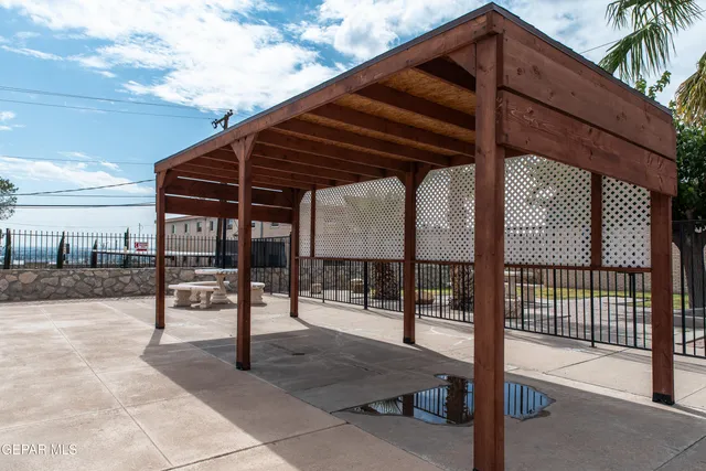 a view of a swimming pool with an outdoor seating
