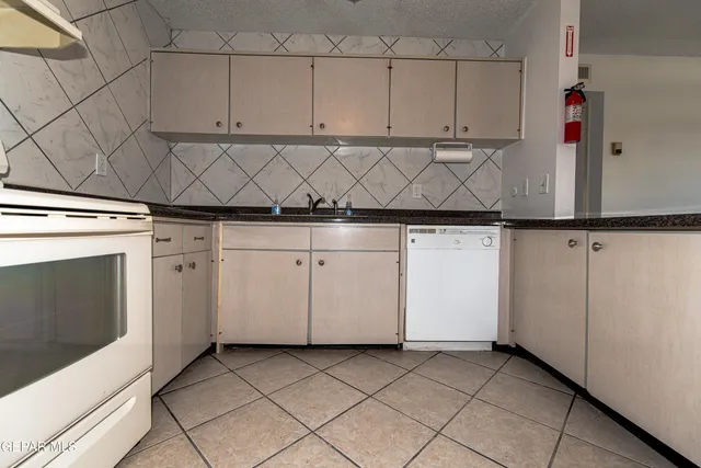 a view of a kitchen with cabinets