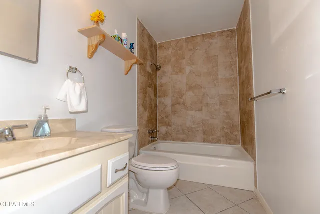 a bathroom with a sink a toilet and a bathtub