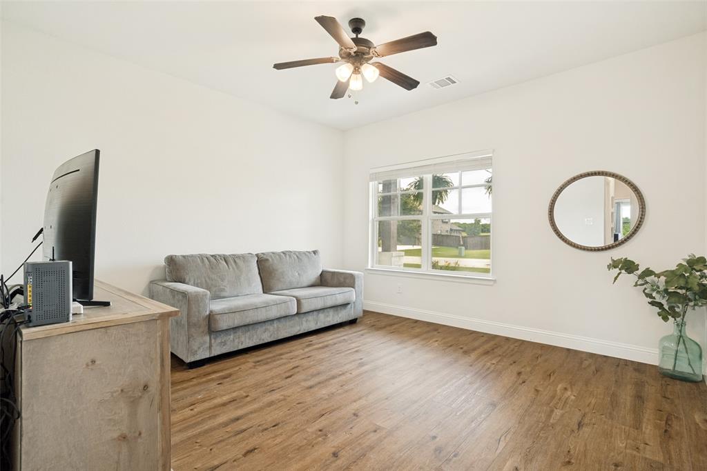 9424 Wildcat Ridge Godley, TX 76044 - Photo 14 of 25 a living room with furniture and a flat screen tv
