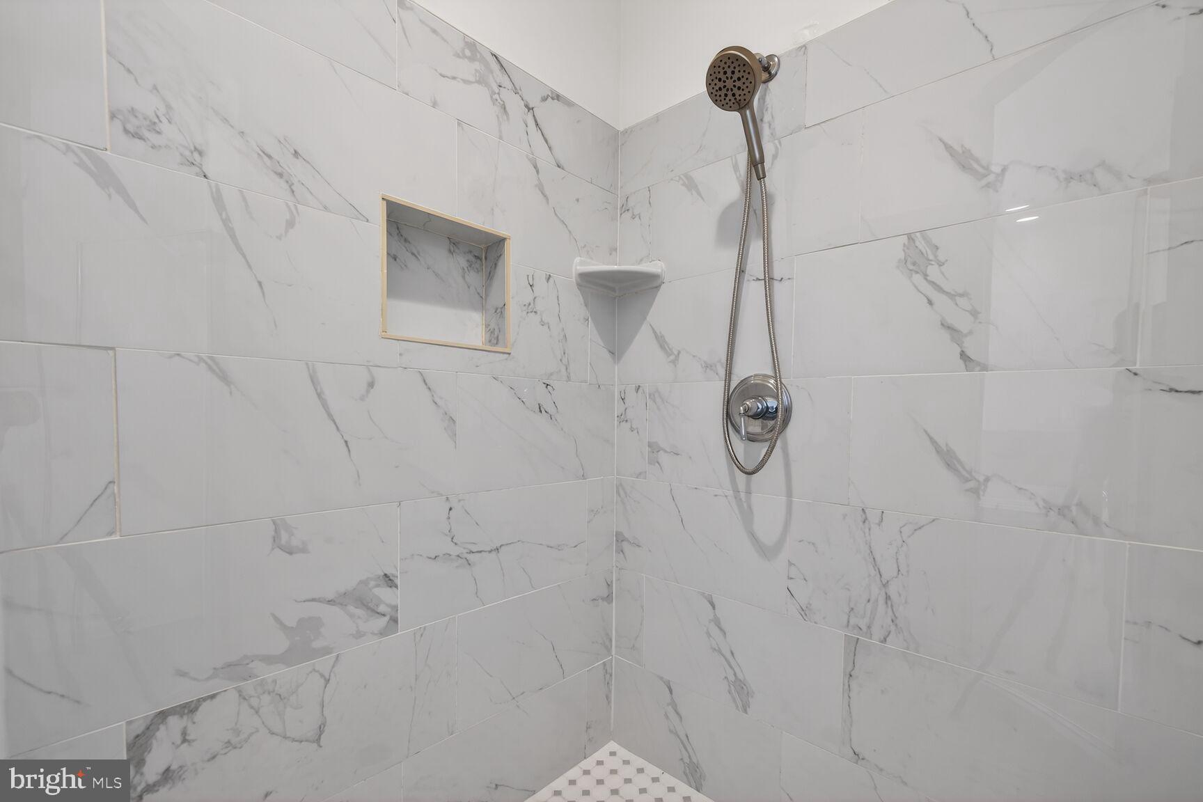 593 Cedar Spring Street Gaithersburg, MD 20877 - Photo 10 of 28 a bathroom with a shower