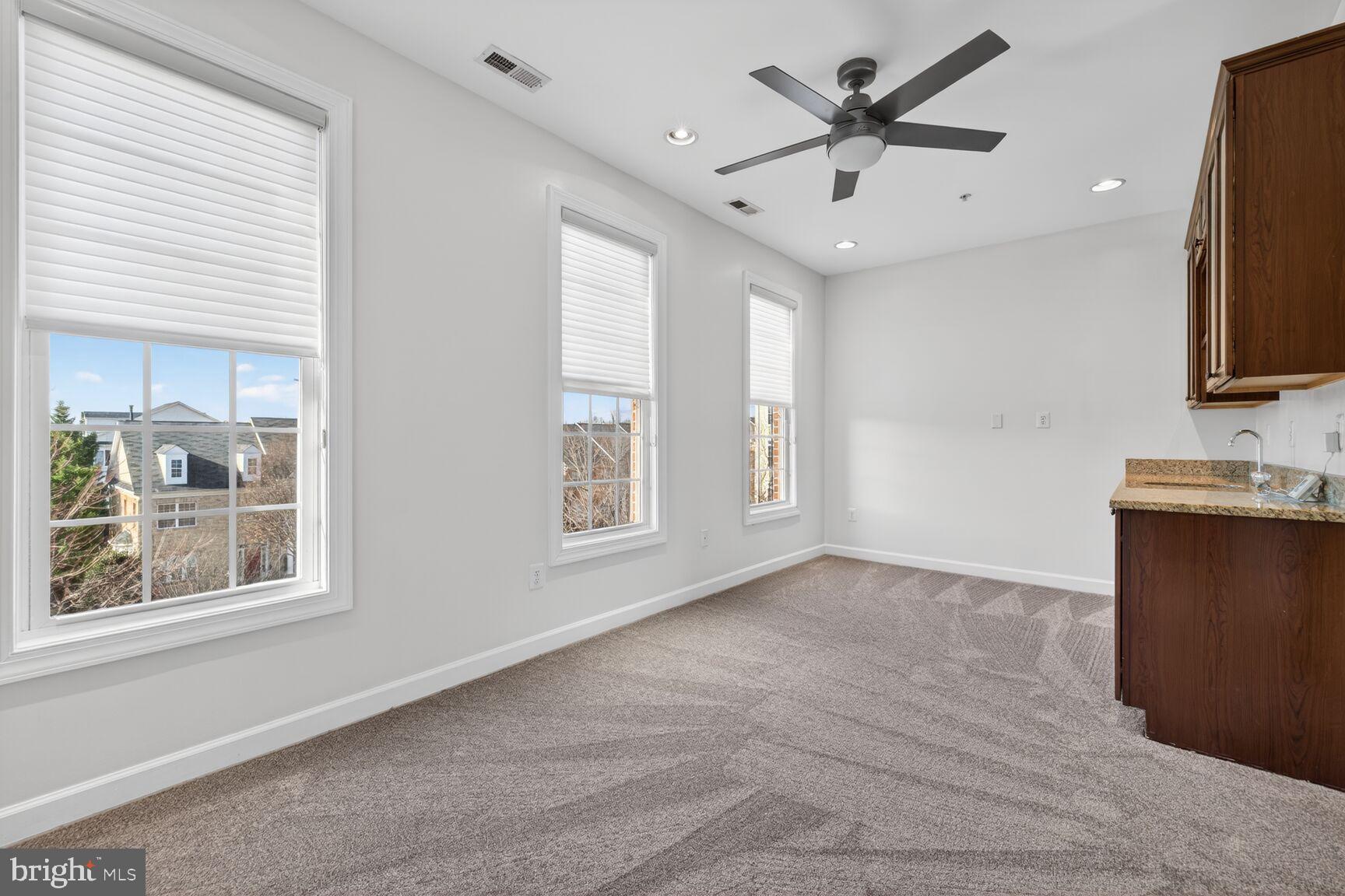 593 Cedar Spring Street Gaithersburg, MD 20877 - Photo 20 of 28 a view of an empty room with a window