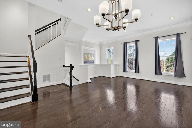 a view of an entryway with wooden floor