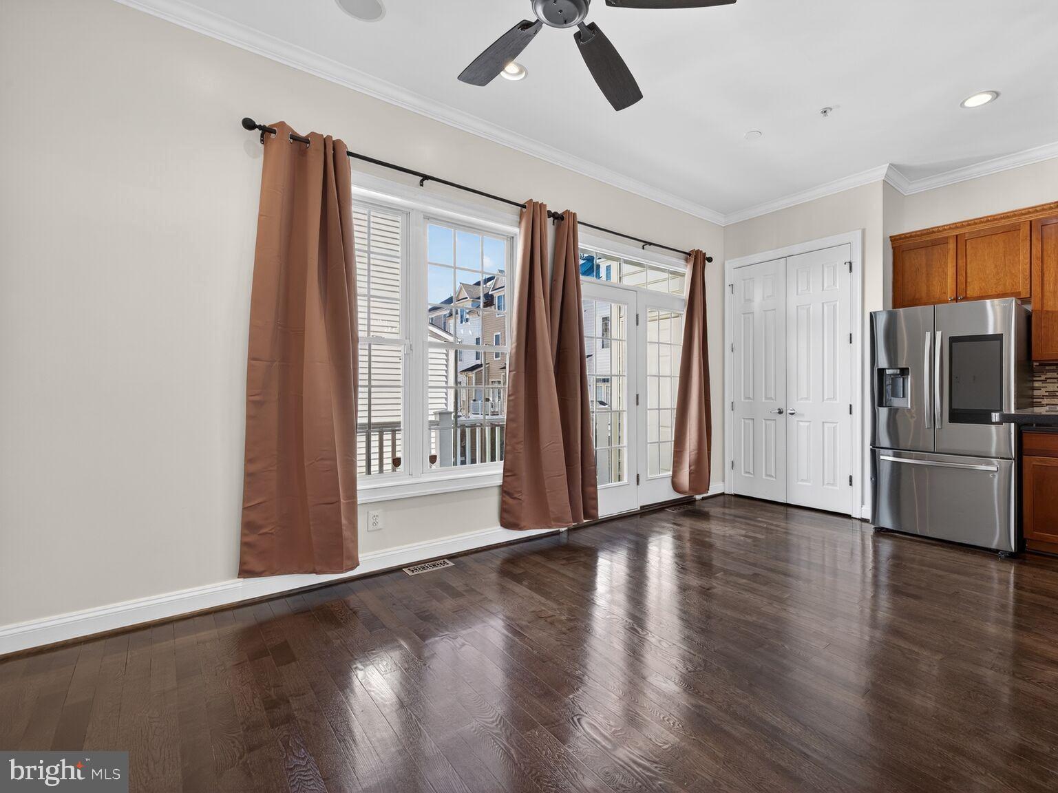 593 Cedar Spring Street Gaithersburg, MD 20877 - Photo 5 of 28 a view of kitchen with stainless steel appliances wooden floor and a window