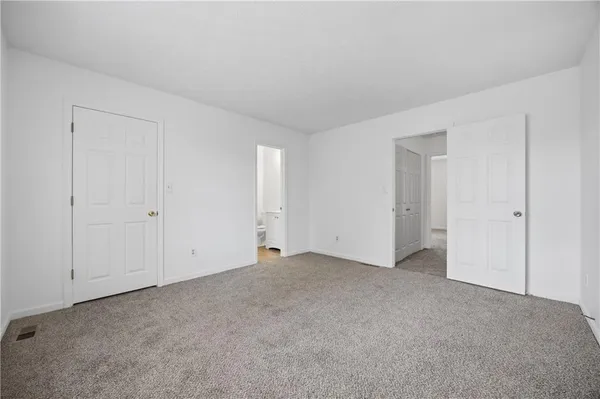 a view of an empty room and entryway