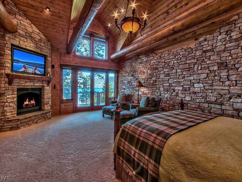93 Shoreline Circle Incline Village, NV 89451 - Photo 17 of 35 a bedroom with bed and a fireplace