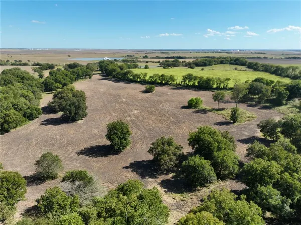 a view of a field with an outdoor space