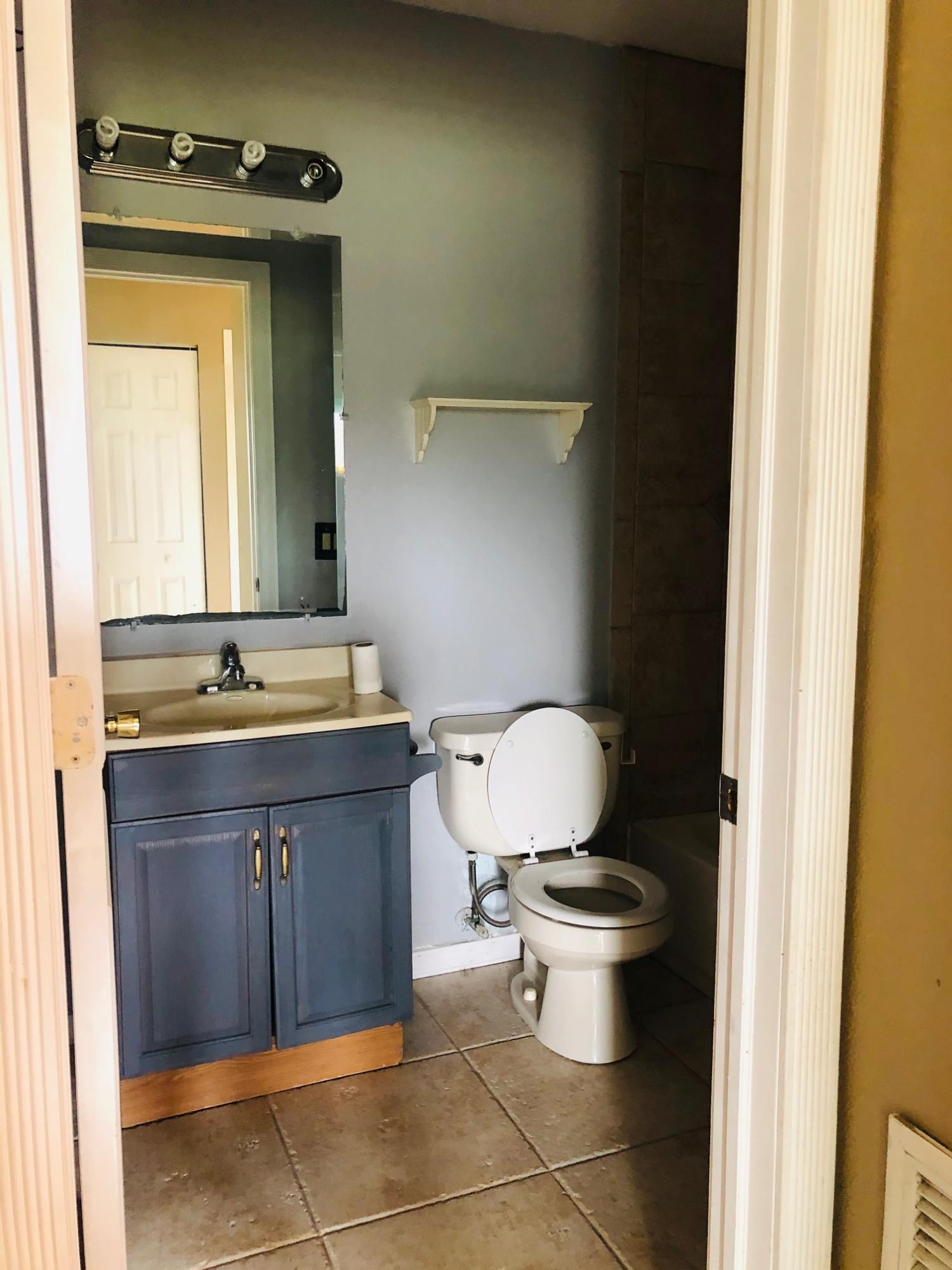 362 Southwest Kentwood Road Port St. Lucie, FL 34953 - Photo 4 of 4 a bathroom with a sink and a toilet