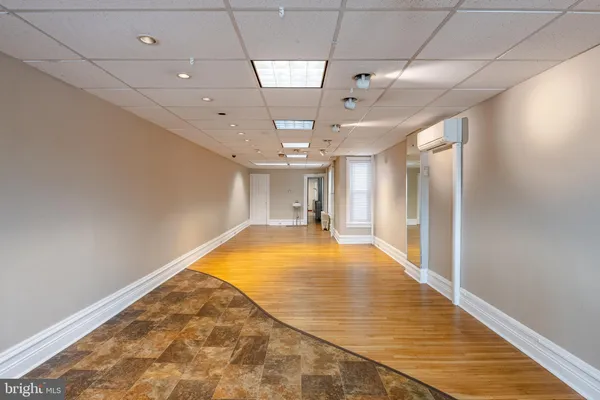 a view of a room with lots of gym equipment