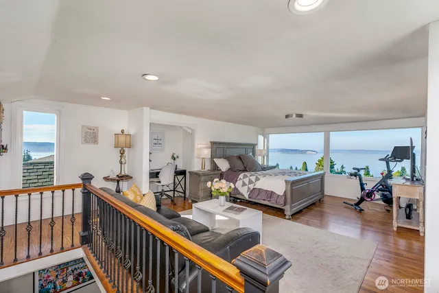 a bedroom with a large bed and a couch