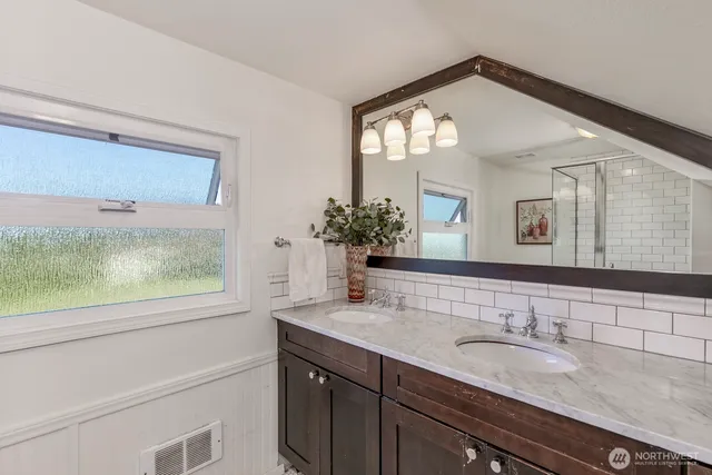 a bathroom with a shower a toilet and a shower