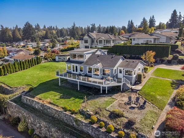 a aerial view of a house with a big yard