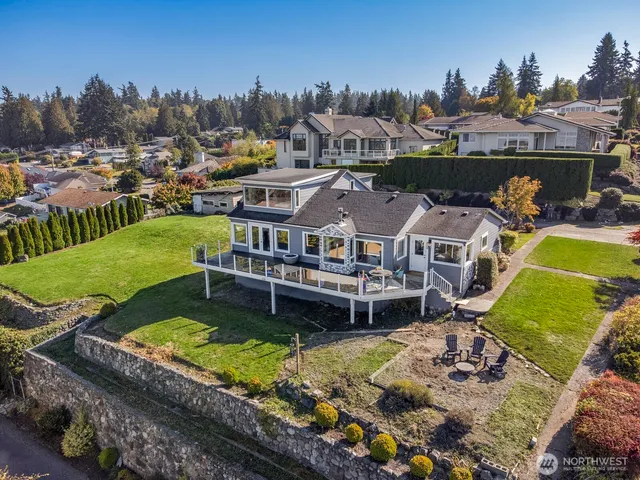 a aerial view of a house with a big yard