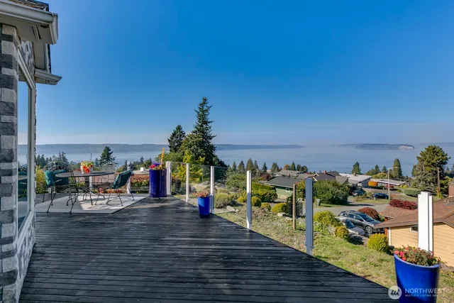 a view of a ocean with sitting area