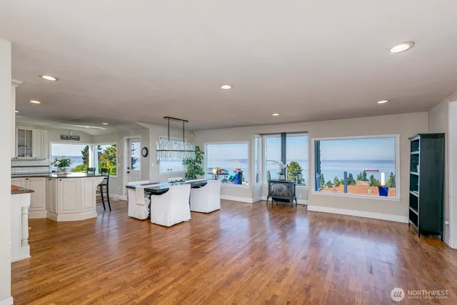 a living room with furniture and view of kitchen