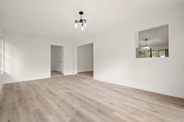 a bathroom with a toilet sink vanity and mirror