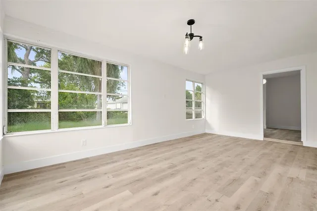 a view of a house with a backyard and a patio