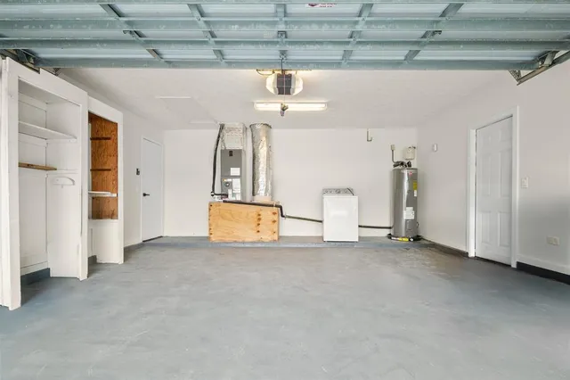 a kitchen with stainless steel appliances granite countertop a refrigerator sink and white cabinets
