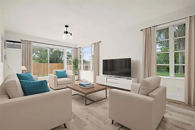 a bedroom with bed and a window