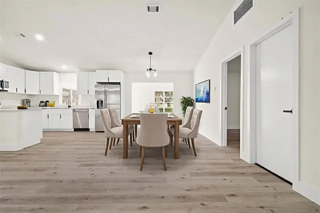 a bedroom with bed and a window