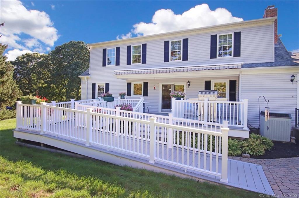 134 Davis Road Seymour, CT 06483 - Photo 1 of 1 a view of a house with wooden deck and a yard