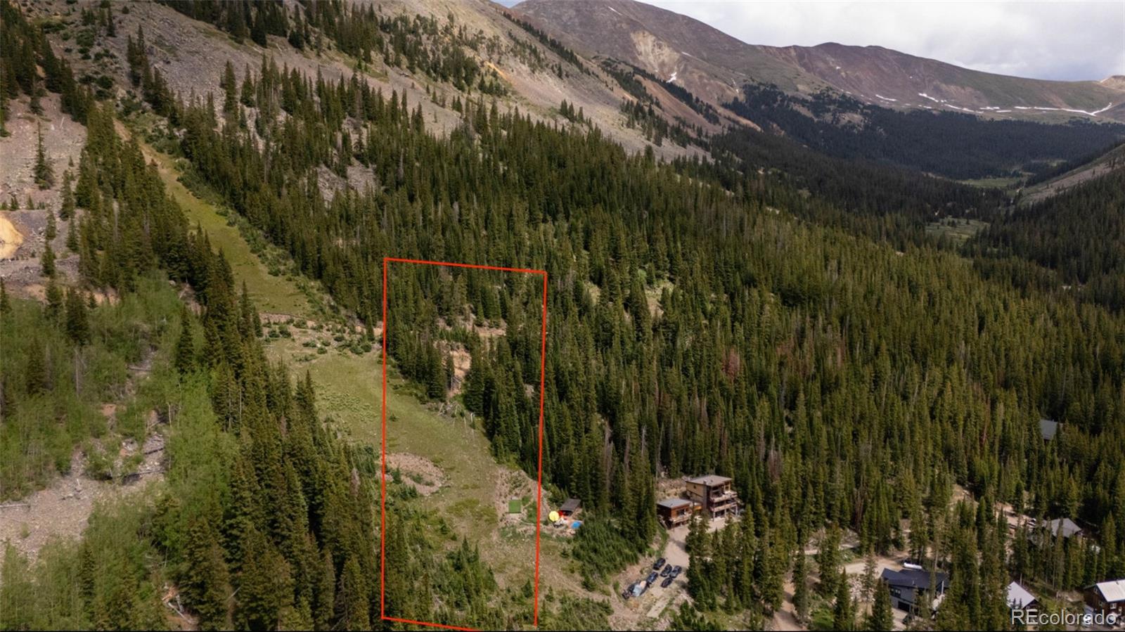 392 Bullion Mine Road Dillon, CO 80435 - Photo 2 of 2 a view of a lush green forest with mountains in the background