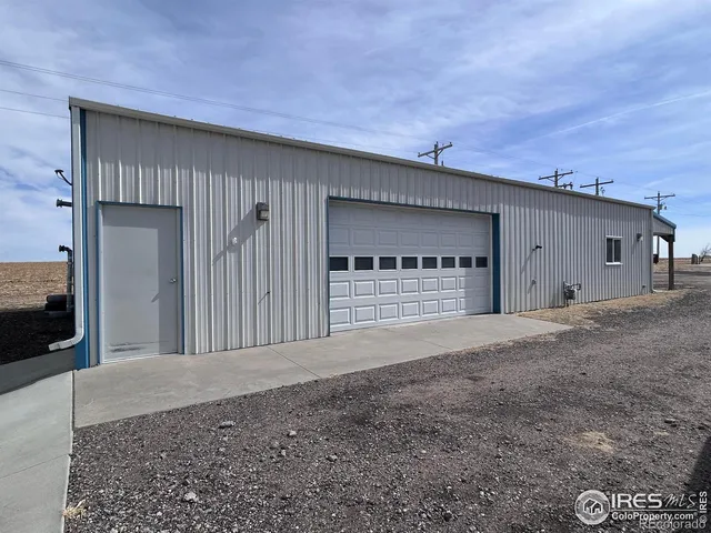 a view of a parking space in front of a house