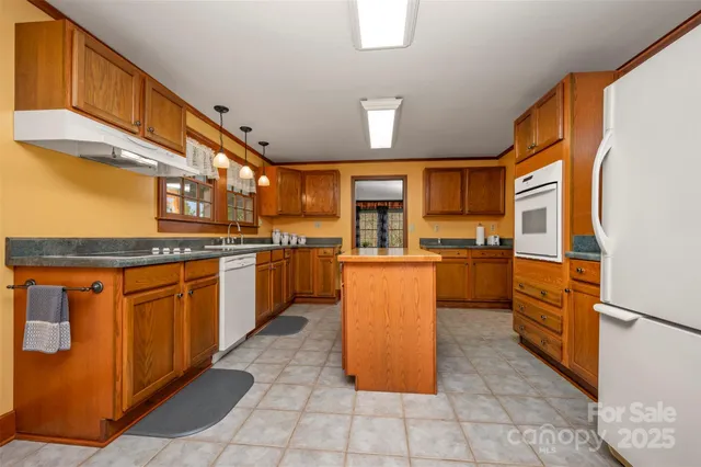 a view of a dining room with furniture and a window