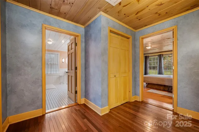 a room with a bed and a chandelier