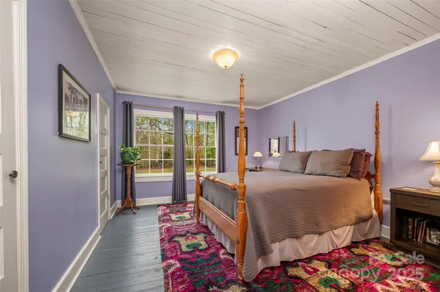 a spacious bedroom with a bed and cabinets