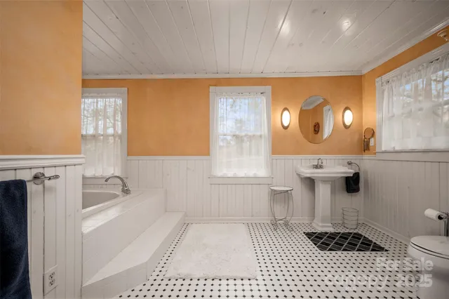 a bathroom with a bathtub and a sink