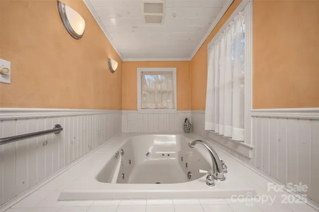 a bathroom with a sink a toilet a shower and a mirror