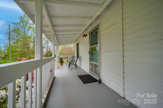 a view of a porch with wooden floor and outdoor space