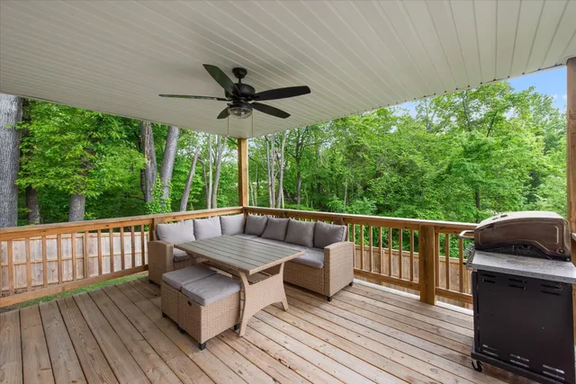 a view of balcony with wooden floor and outdoor seating