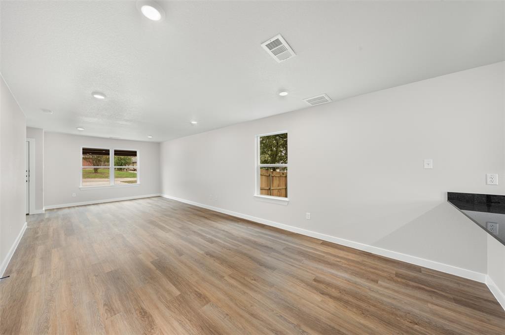 1536 Alexander Avenue, Unit A & B Waco, TX 76708 - Photo 13 of 31 Spacious living area featuring light-toned flooring, recessed lighting, and white walls