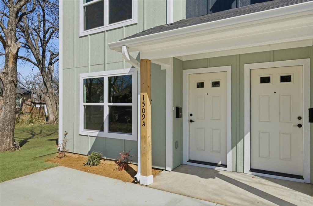 1536 Alexander Avenue, Unit A & B Waco, TX 76708 - Photo 3 of 31 The property features a light green exterior with white trim, a gabled roof, and a covered entryway