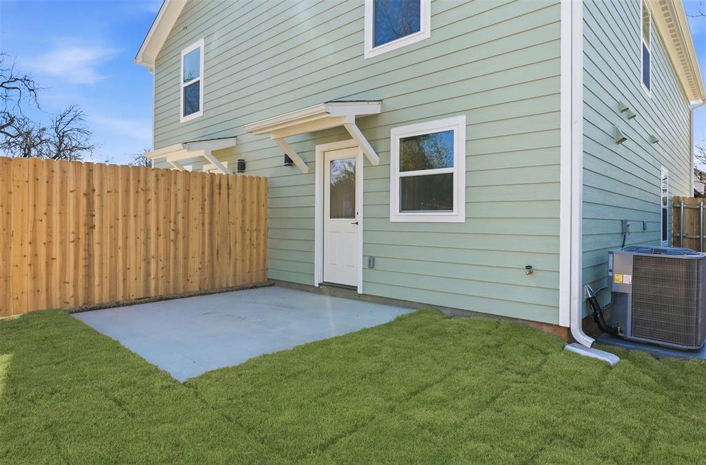 1536 Alexander Avenue, Unit A & B Waco, TX 76708 - Photo 5 of 31 The property features a concrete patio area, a wood fence, and a lawn