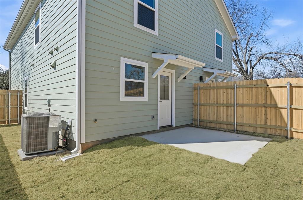 1536 Alexander Avenue, Unit A & B Waco, TX 76708 - Photo 8 of 31 The property features a private backyard with a concrete patio, a wooden privacy fence, and a well-maintained lawn