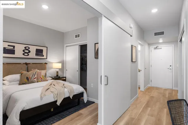 a bedroom with a bed and a walk in closet