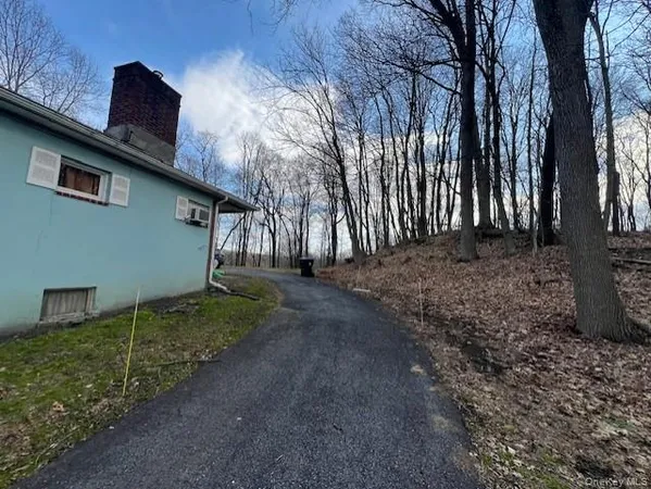 a view of a backyard of the house