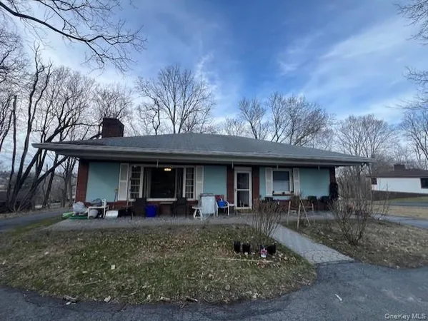 a front view of house with yard and seating