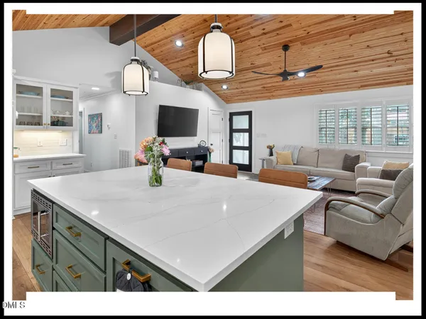 a view of a living room and kitchen