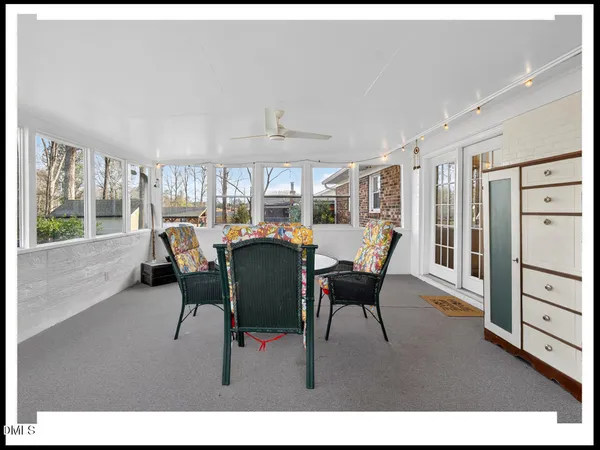 a dining room with furniture and window