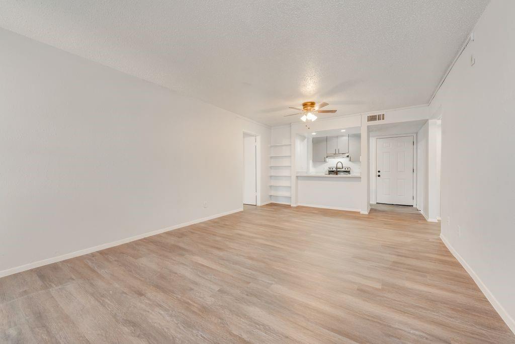 5514 Boca Raton Boulevard, Unit 438 Fort Worth, TX 76112 - Photo 5 of 25 VIEW OF THE BREAKFAST BAR FROM THE LIVING ROOM AND DINING AREA