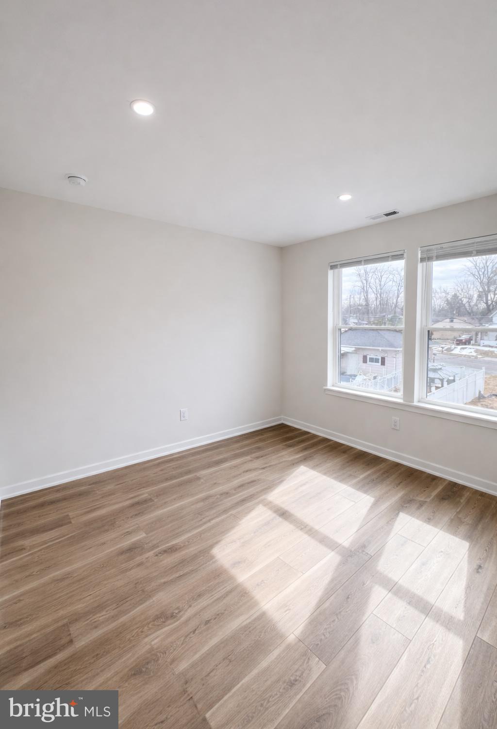 415 Almonesson Road Blackwood, NJ 08012 - Photo 13 of 26 an empty room with wooden floor and windows