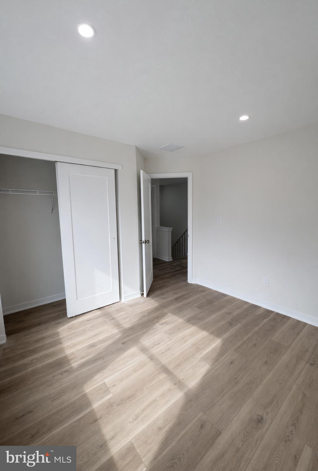 415 Almonesson Road Blackwood, NJ 08012 - Photo 14 of 26 a view of an empty room with wooden floor and closet