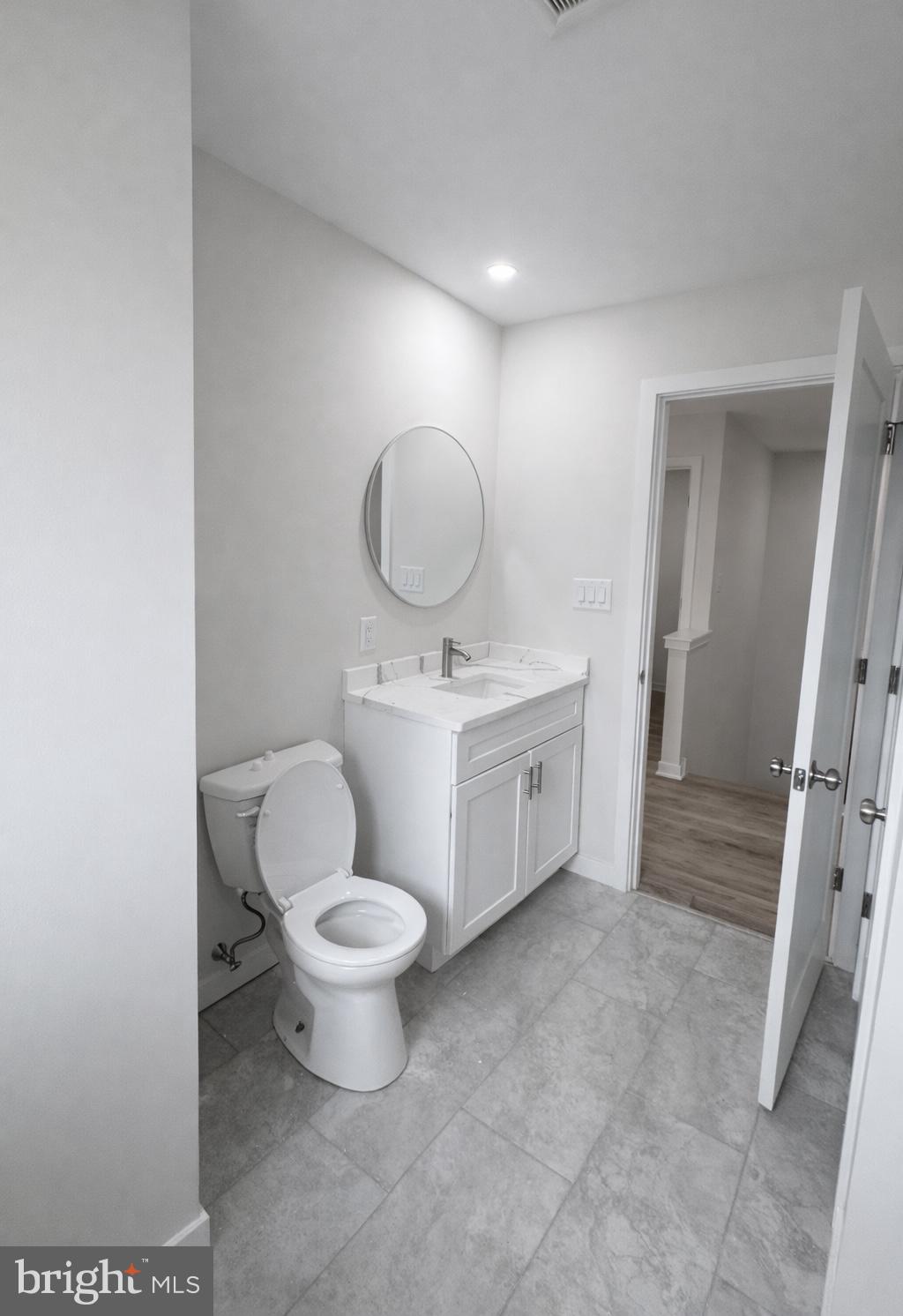 415 Almonesson Road Blackwood, NJ 08012 - Photo 16 of 26 a bathroom with a toilet sink and mirror