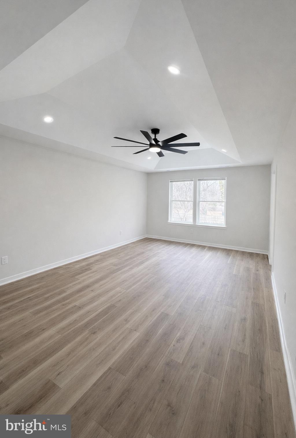 415 Almonesson Road Blackwood, NJ 08012 - Photo 17 of 26 a view of an empty room with wooden floor and a window