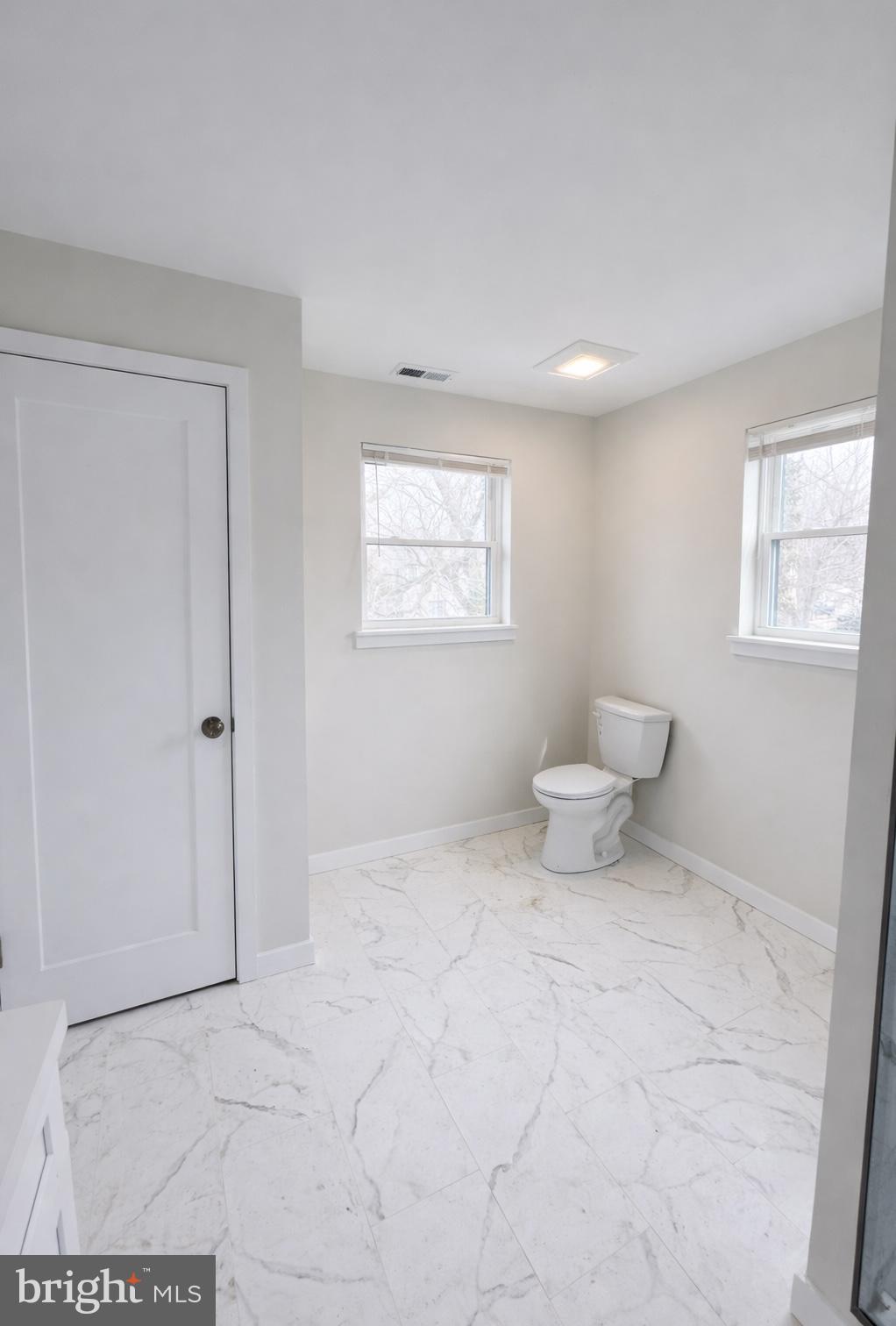 415 Almonesson Road Blackwood, NJ 08012 - Photo 23 of 26 a bathroom with a toilet a sink and a shower