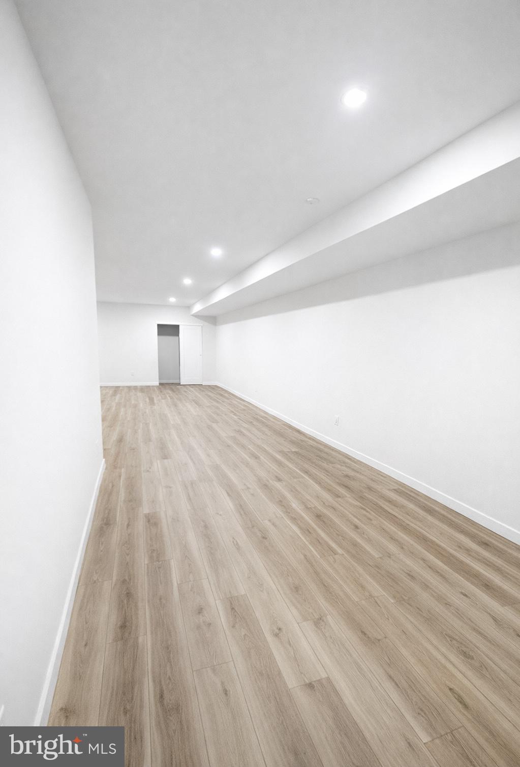 415 Almonesson Road Blackwood, NJ 08012 - Photo 24 of 26 a view of an empty room with wooden floor